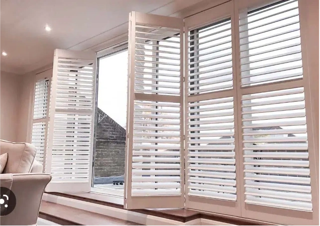 Wooden shutter blinds in room