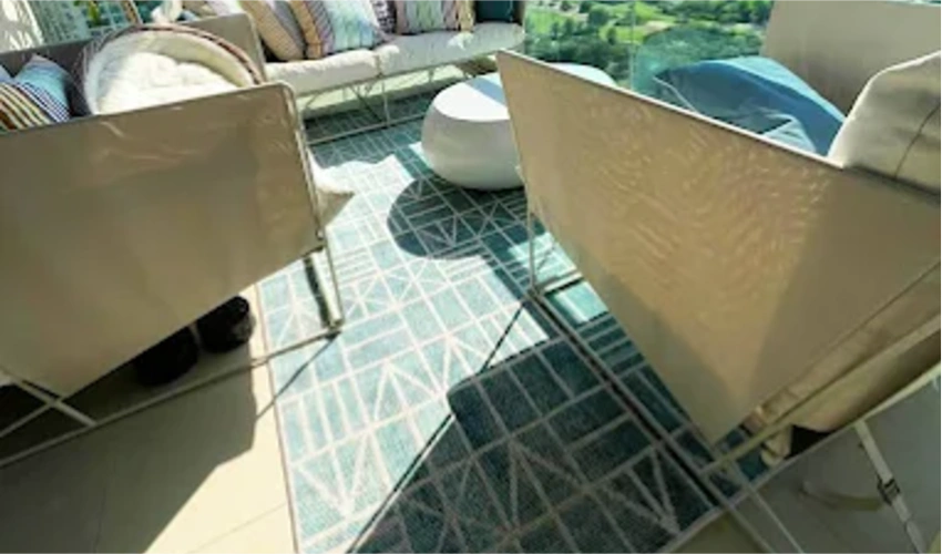 Stylish outdoor space with carpet