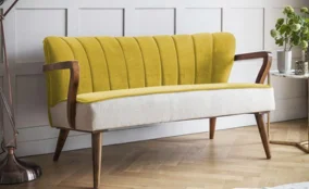 Modern accent sofa in Dubai with yellow and beige fabric and wooden frame