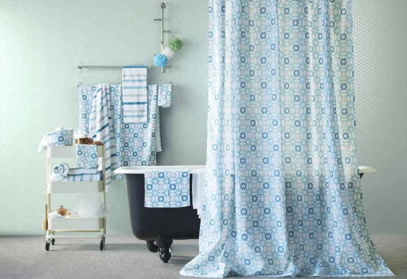 Blue patterned shower curtain in a modern Dubai bathroom
