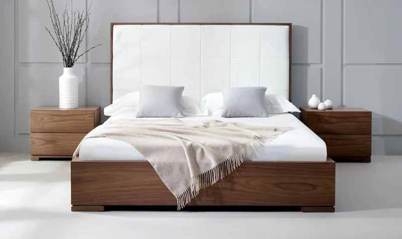 Modern wooden bed with white headboard