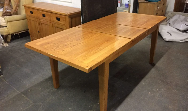 Polished wooden dining table in Dubai with smooth glossy finish