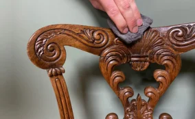 Polishing carved wooden chair in Dubai to restore shine and protect the surface