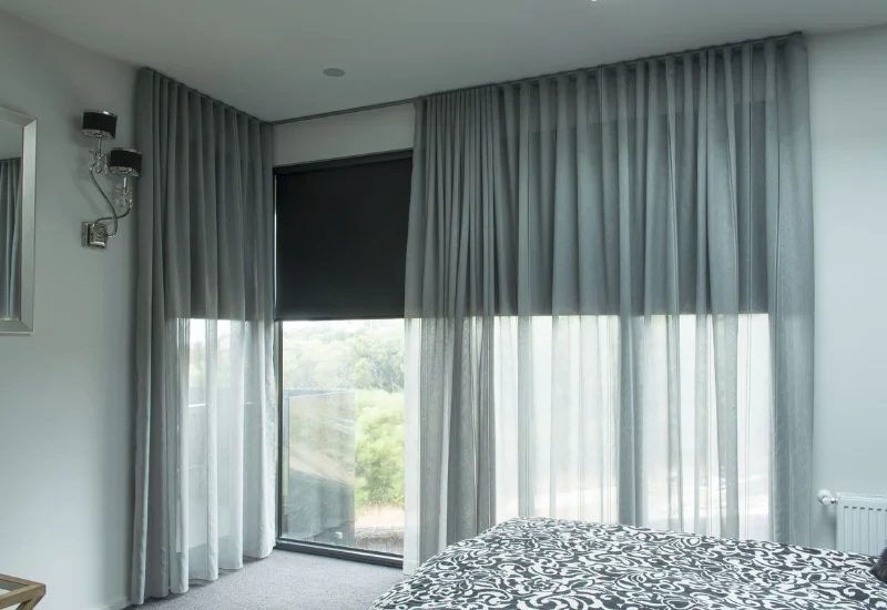 Grey sheer curtains with blackout blind in Dubai bedroom