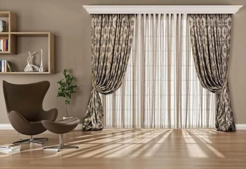Patterned curtains with sheer panels in a Dubai living room
