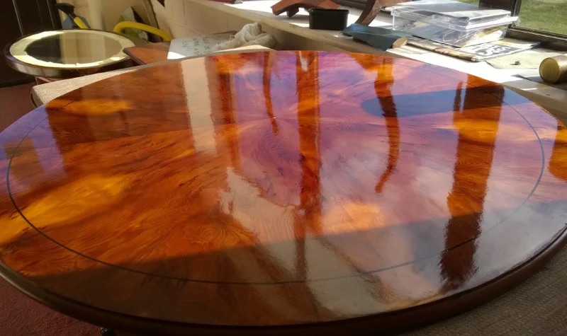 Shiny polished round wooden table in Dubai with glossy finish