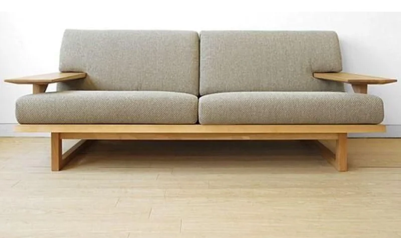 Traditional wooden sofa with beige cushions