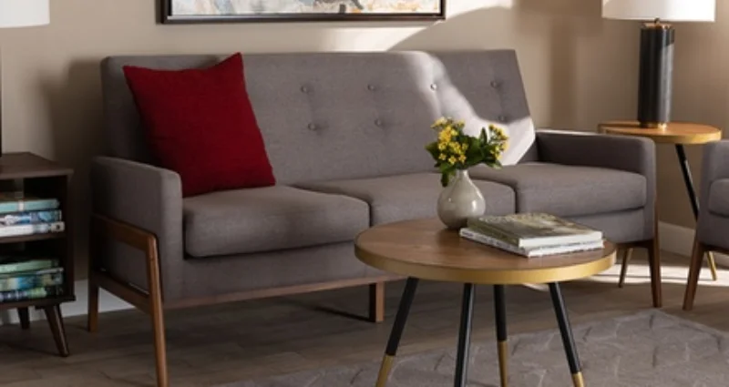 Wooden sofa with upholstered cushions