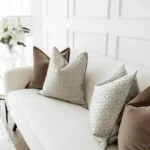 Brown velvet and copper geometric pillows