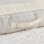 Estonished textured floor cushion handle